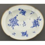 A Worcester dish, c1770, of lobed oval shape on flared foot, painted in 'Dry Blue' enamel with