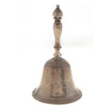 A Victorian silver table bell, engraved with flowers and foliage around a vacant cartouche, baluster