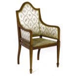 A Victorian mahogany elbow chair, line inlaid with satinwood, on square tapering forelegs, seat