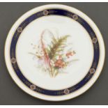 A Royal Worcester plate, 1879, painted with heaths in cobalt and raised gilt border, rim gilt, 22.