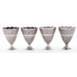 A set of four Ottoman silver zarfs, late 19th c, on flared foot, turned with wavy bands, 60mm h,