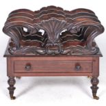 A Victorian carved rosewood canterbury, on turned legs and brass castors, 44cm h; 53 x 37cm Minor