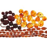 Two necklaces of amber beads, miscellaneous irregular shaped amber beads and an unstrung necklace of