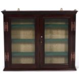 A mahogany glazed wall hanging display cabinet, with copper art nouveau style hinges, 56cm h, 69cm