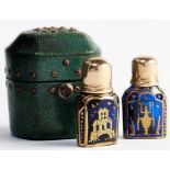 A pair of English gold capped blue glass scent bottles and shagreen case, the gilding possibly by