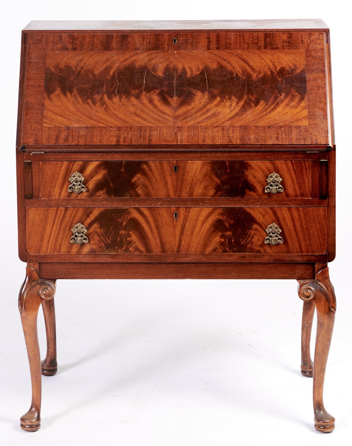 A mahogany bureau, c1930, the sliding interior with pair of EPNS capped glass inkwells, on