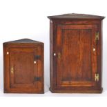 A Victorian oak corner cupboard with panelled door, 91cm h; 72cm w and a contemporary oak corner