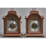 A pair of reproduction giltmetal mounted oak arch top bracket clocks, the silvered and brass dial