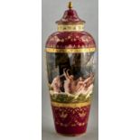 A Vienna style claret ground vase and cover, early 20th c, the tapered vase painted with nymphs