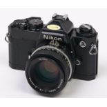 A Nikon FE SLR 35mm camera, with Nikon Nikkor 50mm F1.8 lens In apparently working order, good
