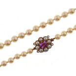 A cultured pearl necklace, composed of a single row of 6mm cultured pearls, with amethyst and
