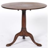 A George III mahogany tilt top tripod table, 84cm diam Top split, old repairs to top supports and an