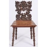 A Victorian carved walnut hall chair, with boarded seat on bobbin turned legs, seat height 43cm