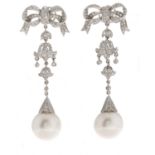 A pair of diamond and South Sea cultured pearl earrings, the 14mm cultured pearl suspended from a