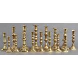 Eight pairs of turned brass candlesticks, Victorian and later, 16-26cm h, Overall good condition,