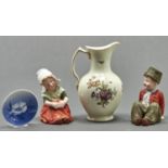 A Royal Copenhagen jug, decorated with flowers, 24cm h and three other items (4) The lot in good