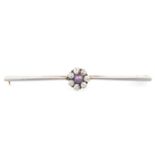 A diamond and black cultured pearl bar brooch, diamonds 0.55ct total, in gold, 4.1g