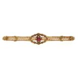 A bar brooch, paste set, in gold marked 10k, 3.1g