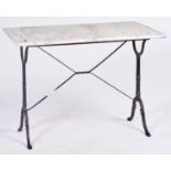 A cast iron table, the rectangular frame on two warped end supports, with marble top, 74cm h; 59 x