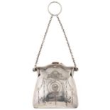 A silver bag shaped purse, each side engraved with circular cartouches beneath ribbon tied floral