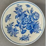A Worcester blue and white saucer, c1770, transfer printed in underglaze blue with the Three Flowers