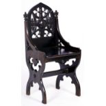 A Victorian ebonised mahogany hall chair with pierced splat, seat height 50cm Some shrinkage and old