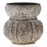 An Indian silver repousse jar, late 19th c, worked in high relief with panels of deities, 11cm h,
