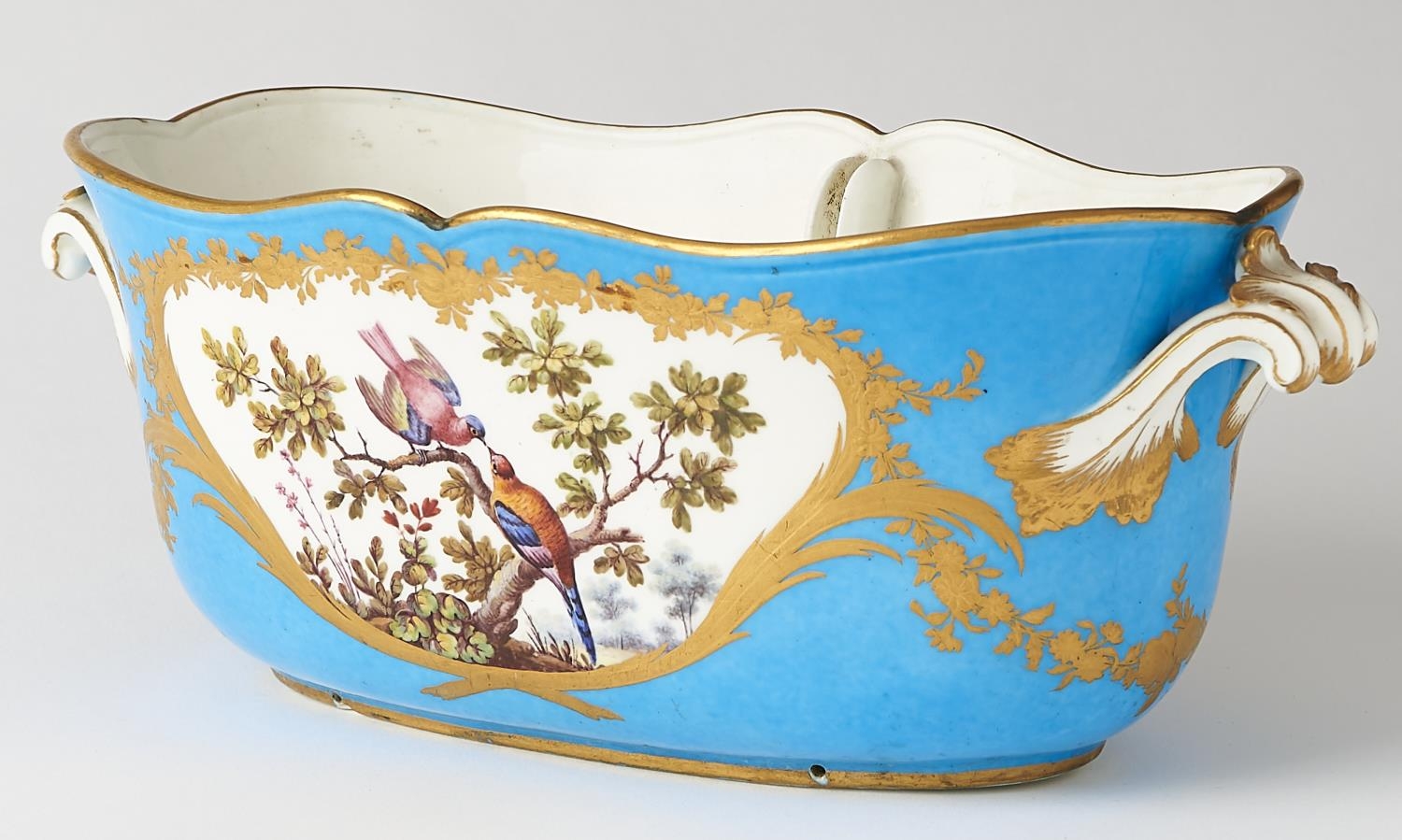 A Sevres seau a liqueur ovale, 1773, painted by F-J Aloncle to both sides with birds in cisele