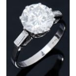 A diamond ring, the round brilliant cut diamond of approximately 2.5ct, K colour and VS 2 clarity, a