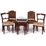 A pair of Victorian walnut framed dining chairs with concave backs with incised decoration, the
