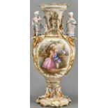 A French porcelain vase, c1870, with polychrome biscuit porcelain boy and girl figural handles,