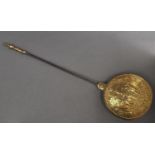 A Dutch brass warming pan, late 17th c, the slightly domed repousse lid worked with the figures of