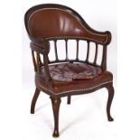 A Victorian mahogany armchair, covered in brown nailed back leather, seat height 42cm Repair to