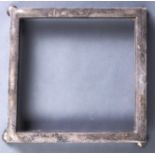 A George V square silver table frame, on four ball feet, 29.5 x 30.5cm, by W Comyns & Son Ltd,