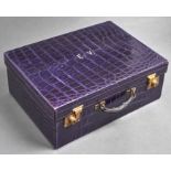 A fine silver fitted purple crocodile hide dressing case by Drew & Sons, retaining the full