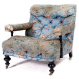 A Victorian ebonised open armchair, late 19th c, in the original light blue ground rose and bird