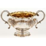 A William IV silver sugar bowl, en suite with the preceding lot, 21cm w over handles, London 1835,