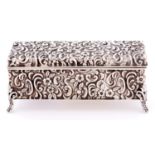 A Victorian die stamped rectangular silver trinket box, decorated with flowers and c scrolls