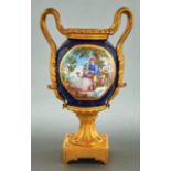 A French ormolu mounted porcelain vase, late 19th c, incorporating the body of a Sevres style