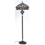 A Tiffany style standard lamp, the coloured glass shades decorated with flowers, 165cm h