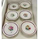 A French porcelain dessert service, C1870, painted to the centre with a rose or other flower in