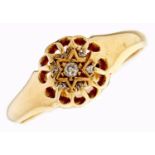 A star centred diamond cluster ring, in 18ct gold, Birmingham 1919, 2.6g, size O Light wear only