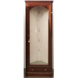 A reproduction mahogany standing corner cupboard, third quarter 20th c, the arched bevelled glazed