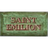 A decorative painted wood name board - Saint Emilion, 20th c, chamfered edges, 30 x 59cm Two corners