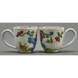 A pair of Liverpool famille rose miniature coffee cups, c1770, painted with a peony and rock