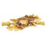 A gold bar brooch set with a citrine, marked 15ct, 4.9g