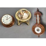 A carved walnut aneroid barometer with enamel dial, 45cm, a reproduction terrestrial globe, 25cm w