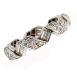 A diamond ribbon shaped eternity ring, with round brilliant and baguette diamonds, in platinum