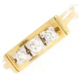 An 18ct gold three stone diamond ring, 4.1g, size M½