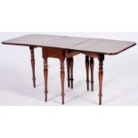 Nursery Furniture. An unusual early Victorian mahogany drop leaf dining table, c1850, on baluster